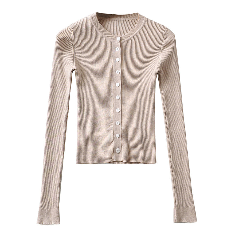Woman wearing Round Neck Buckle Detail Slim Fit Long Sleeve Top in an office setting