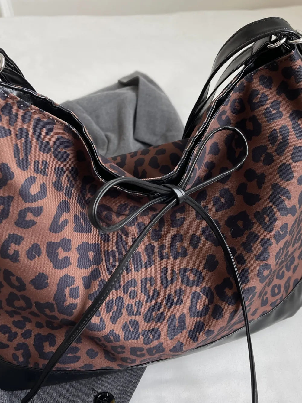 Women's Leopard Print PU Lace-Up Dual Purpose Crossbody Shoulder Bag – Model View | TajStylo