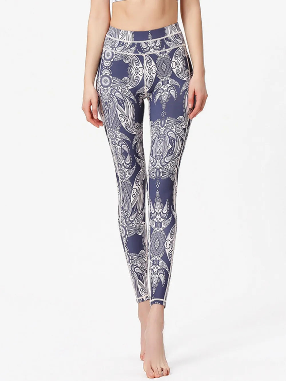 Woman wearing Printed Active High Waist Leggings in a stylish gym setting