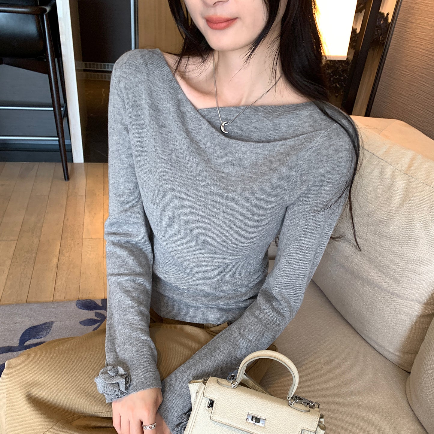 Woman wearing Boat Neck Long Sleeve Slim Fit Knit Top in a stylish setting