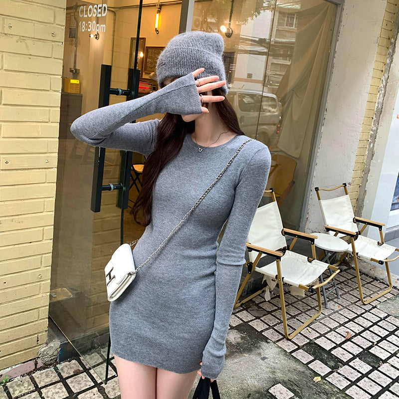 Woman wearing Slim Fit Wool Blend Long Sleeve Sweater in a cozy setting