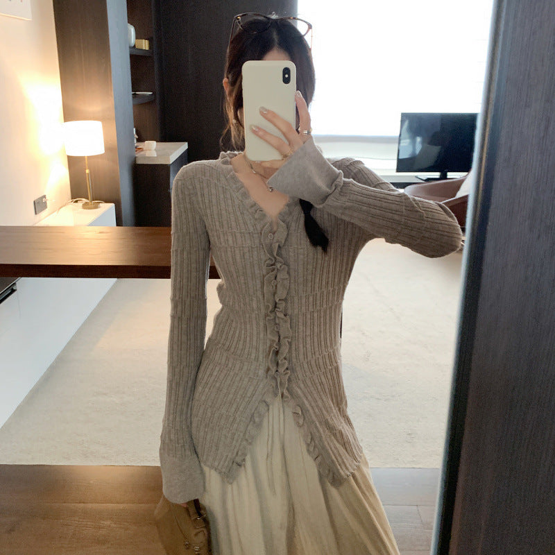 Woman wearing Ruffled V-Neck Slim Fit Cardigan in a stylish setting