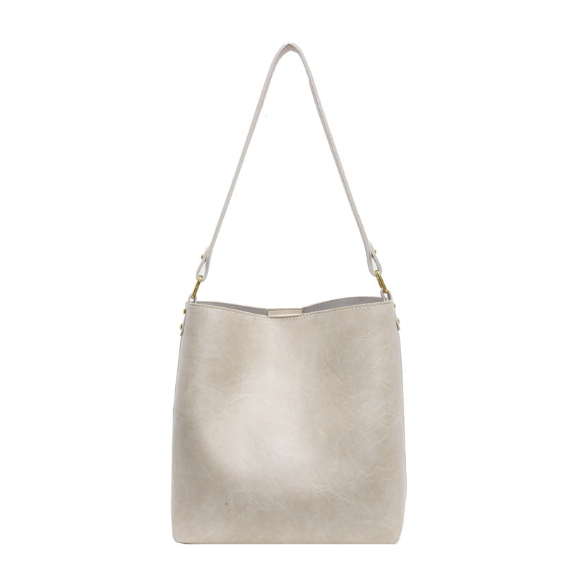 Women's Large Capacity PU Leather Commuter Shoulder Bucket Tote Bag – Model View | TajStylo