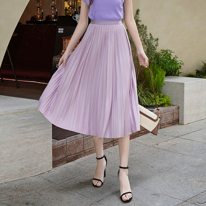 Woman wearing Solid Pleated Skirt in a casual outdoor setting