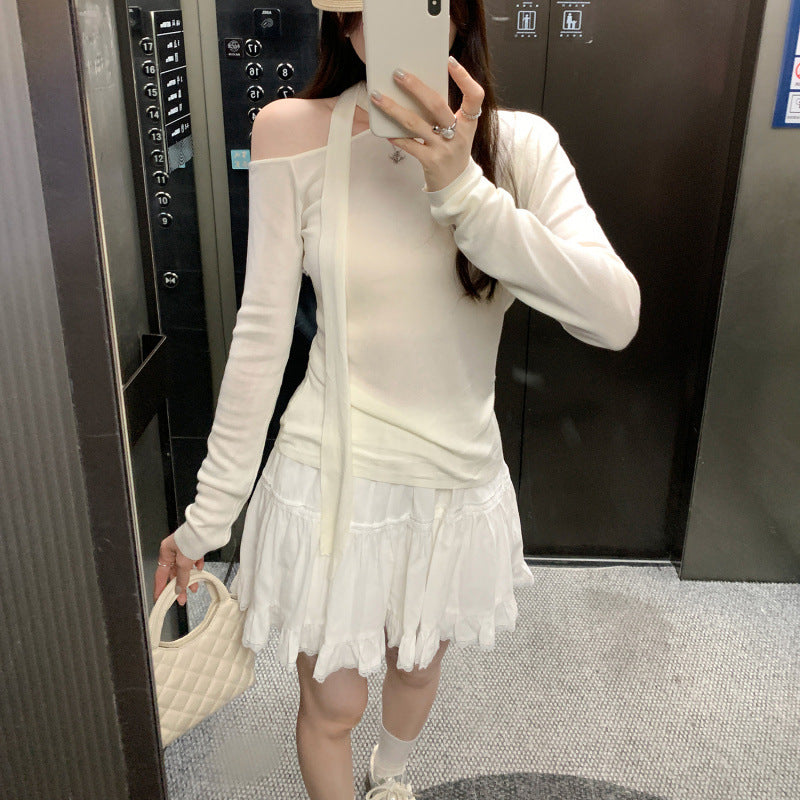 Woman wearing Lace Up Butterfly Long Sleeve Top in a casual setting