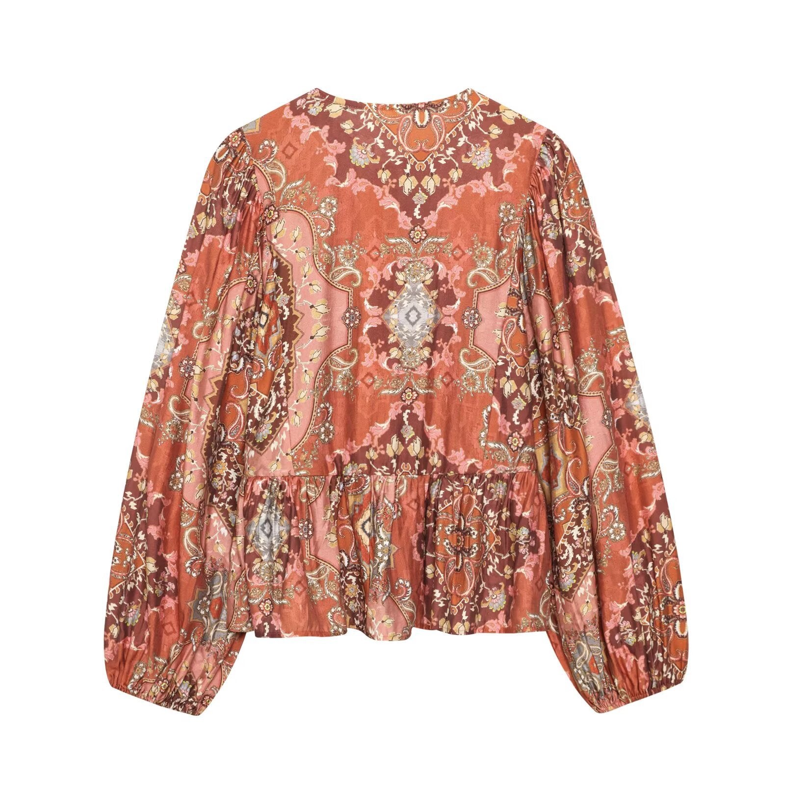 Woman wearing Retro Printed Long Sleeve Top with Skirt Hem in a bright cafe setting