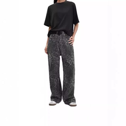 Woman wearing leopard print jeans in a stylish urban setting