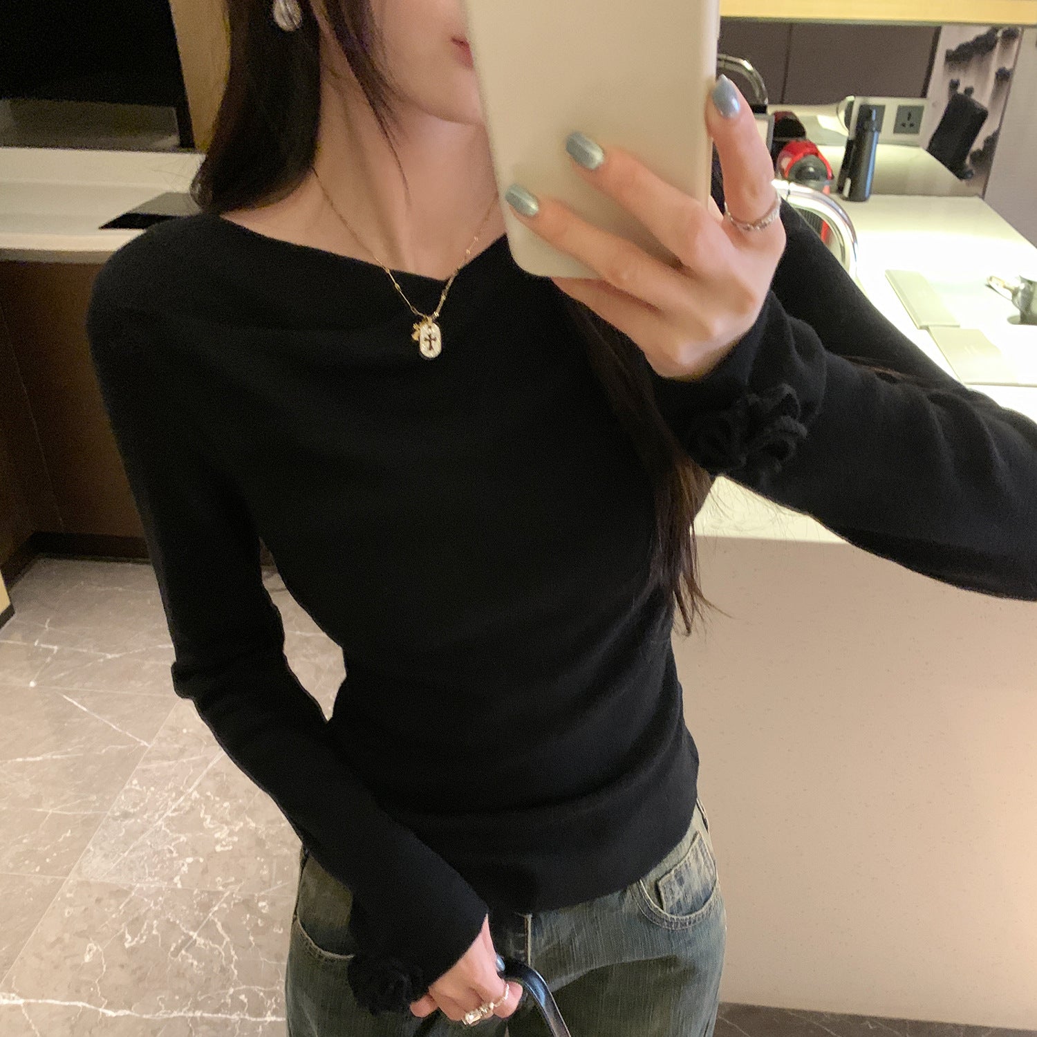 Woman wearing Boat Neck Long Sleeve Slim Fit Knit Top in a stylish setting