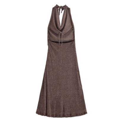 Woman wearing French Backless Metallic Dress in an elegant setting