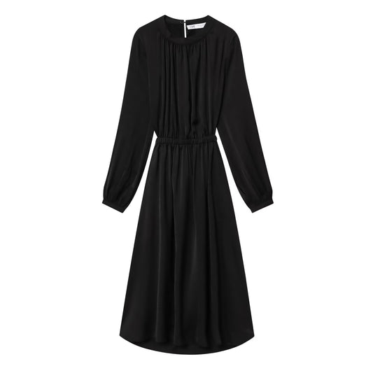 Woman wearing Black Long Sleeve A-Line Dress in a casual setting
