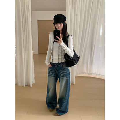 Woman wearing Distressed Wide Leg Jeans in a casual setting