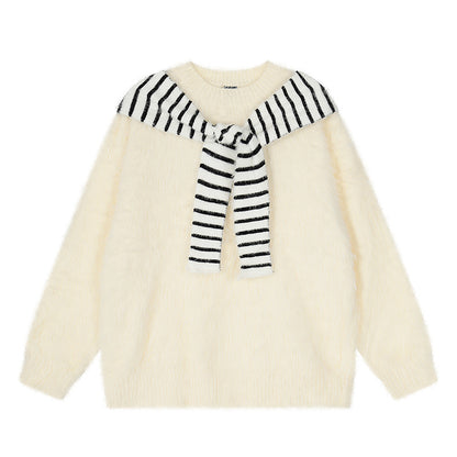 Woman wearing Oversized Loose Fit Poncho Knit Sweater in a cozy indoor setting