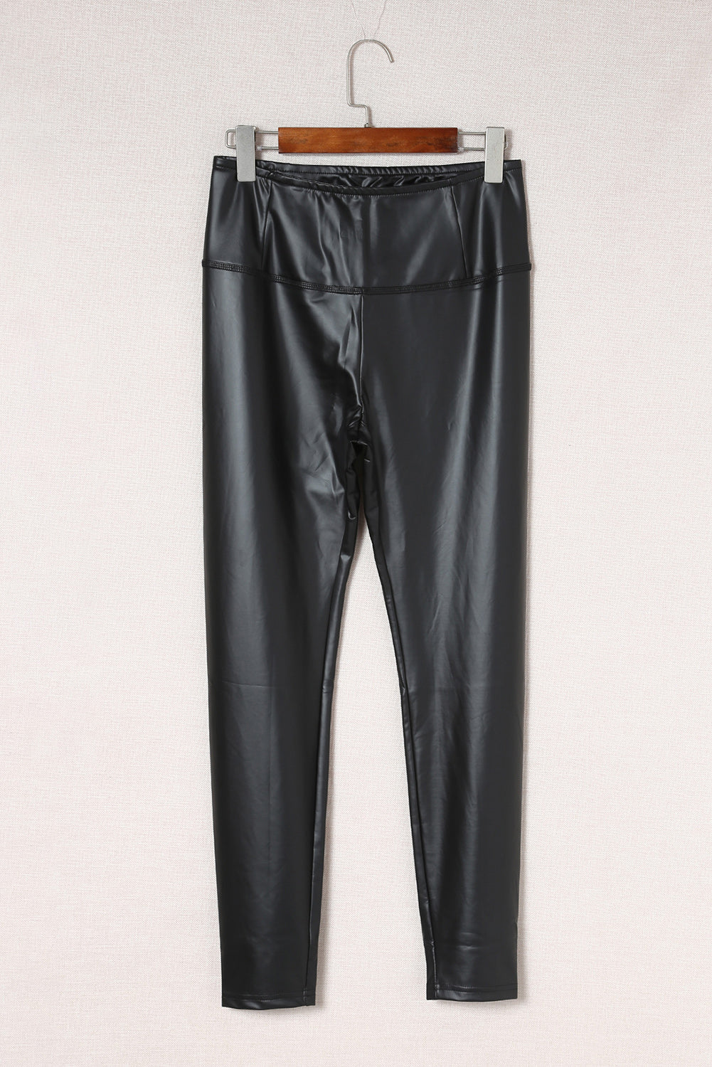 Woman wearing Black Faux Leather High Waist Leggings in a trendy urban setting