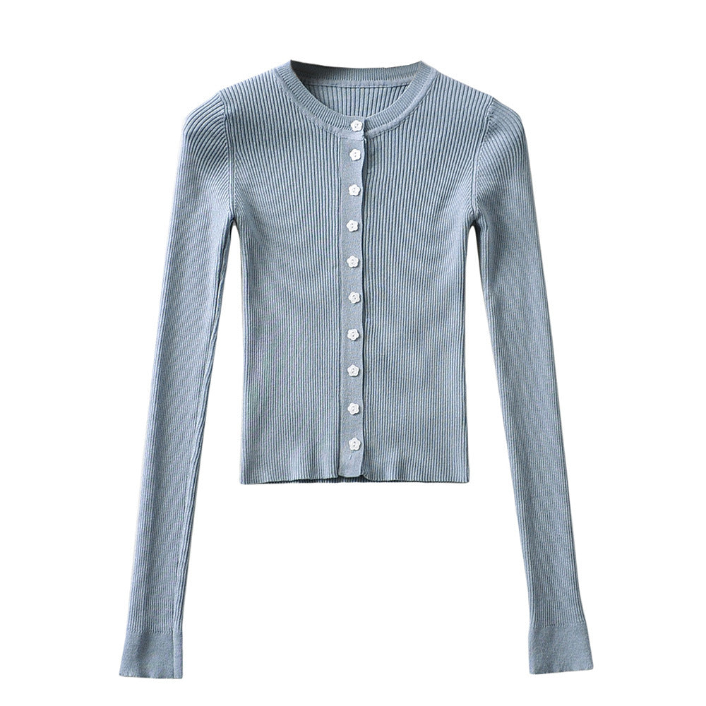 Woman wearing Round Neck Buckle Detail Slim Fit Long Sleeve Top in an office setting