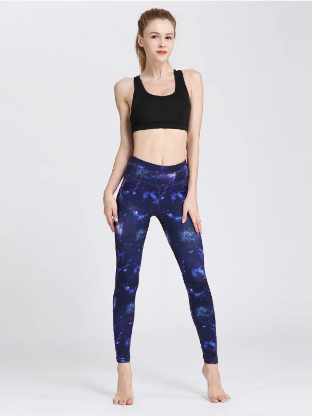 Woman wearing Printed Active High Waist Leggings in a stylish gym setting