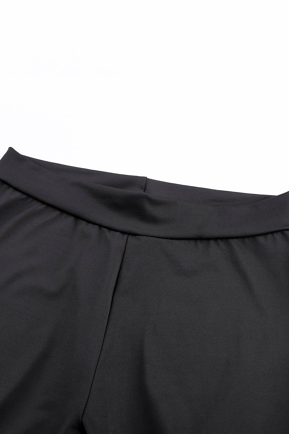 Woman wearing Black Grommet Lace Up Front Leggings in a stylish setting