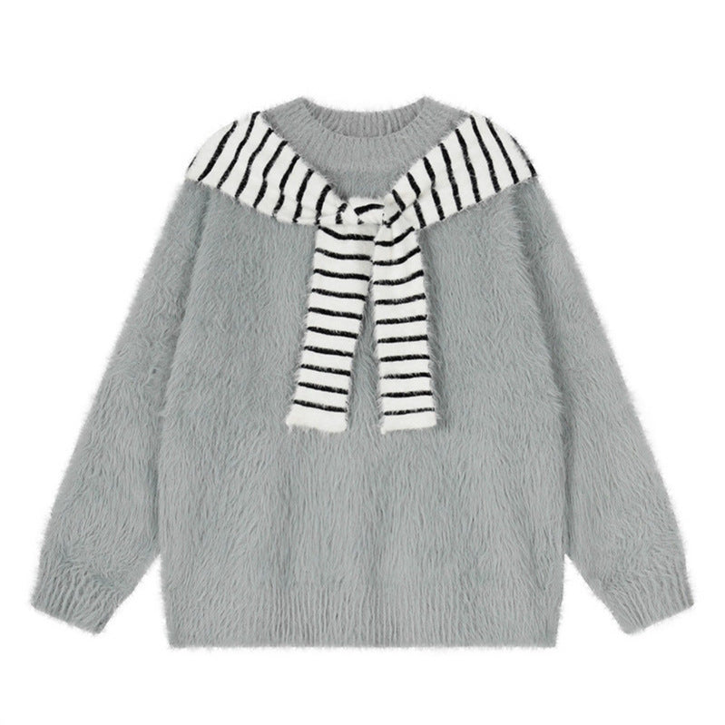Woman wearing Oversized Loose Fit Poncho Knit Sweater in a cozy indoor setting