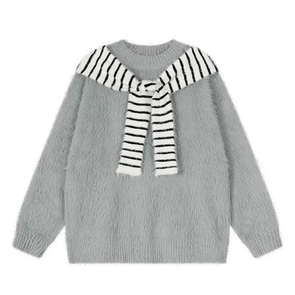 Woman wearing Oversized Loose Fit Poncho Knit Sweater in a cozy indoor setting