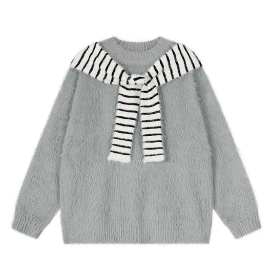Woman wearing Oversized Loose Fit Poncho Knit Sweater in a cozy indoor setting