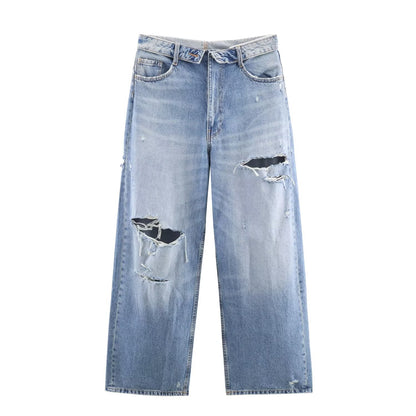 Woman wearing Mid Waist Ripped Straight Leg Jeans in a casual setting