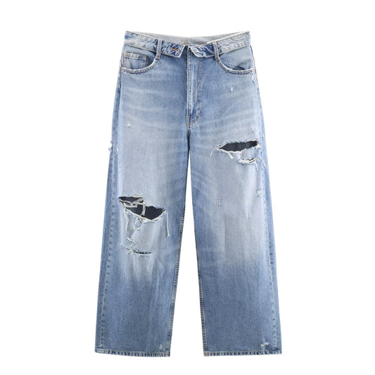 Woman wearing Mid Waist Ripped Straight Leg Jeans in a casual setting