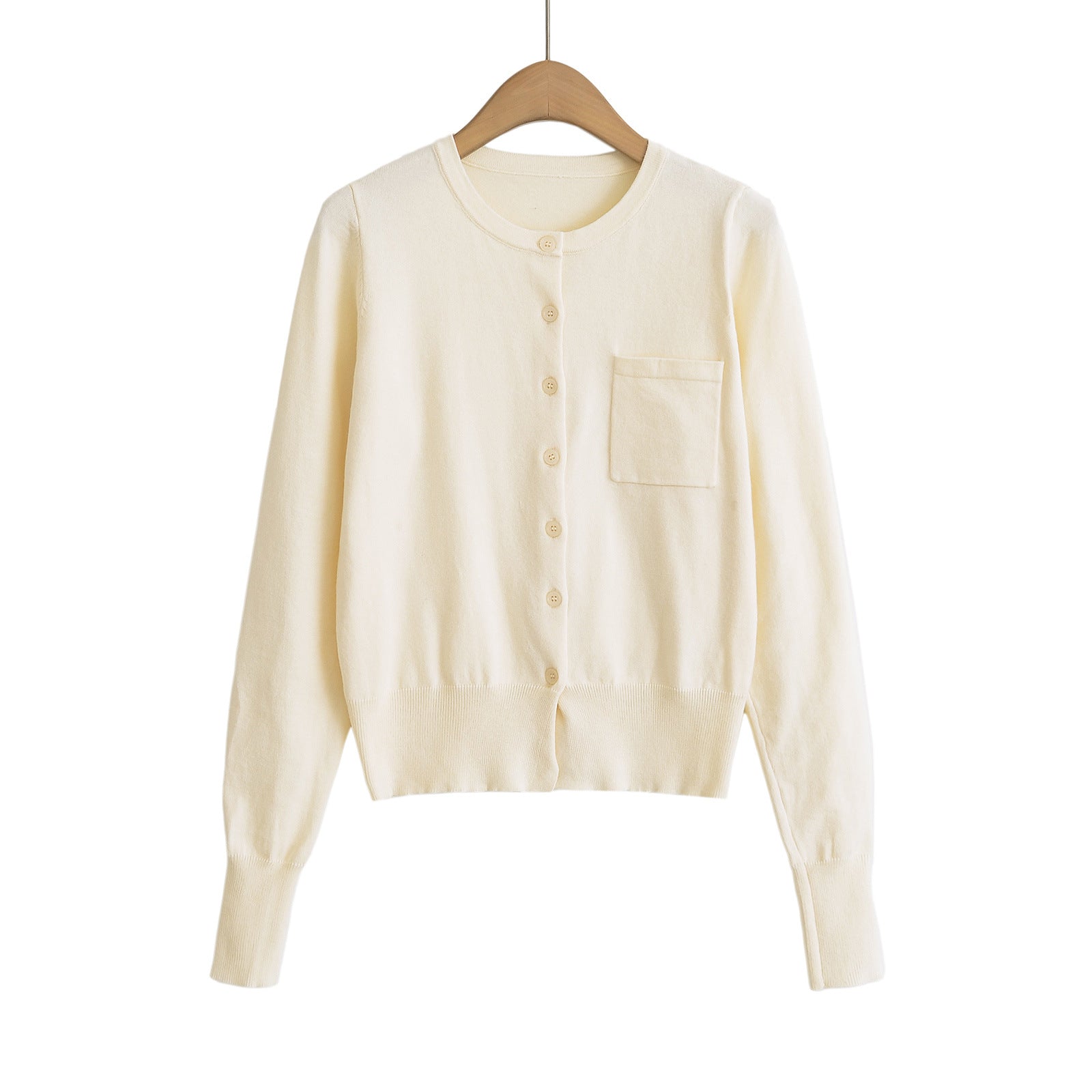 Woman wearing Round Neck Long Sleeve Shirt with Pocket in a casual setting