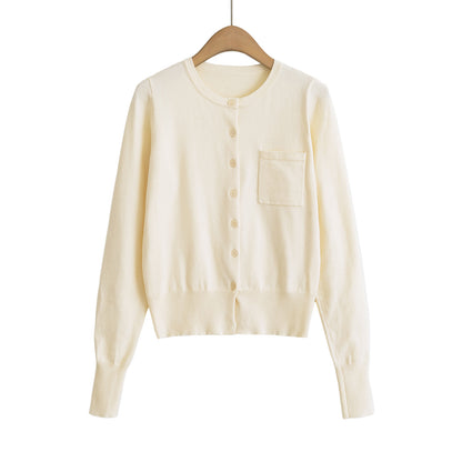Woman wearing Round Neck Long Sleeve Shirt with Pocket in a casual setting