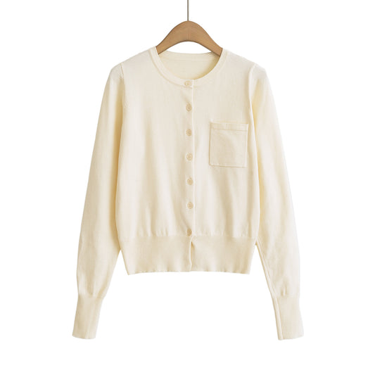 Woman wearing Round Neck Long Sleeve Shirt with Pocket in a casual setting