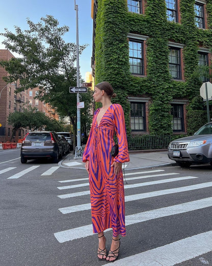 Woman wearing Irregular Stripe Printed Long Dress in a stylish urban setting