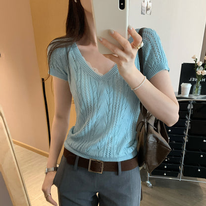 Woman wearing V-Neck Hollow Knit Top in a stylish outdoor setting
