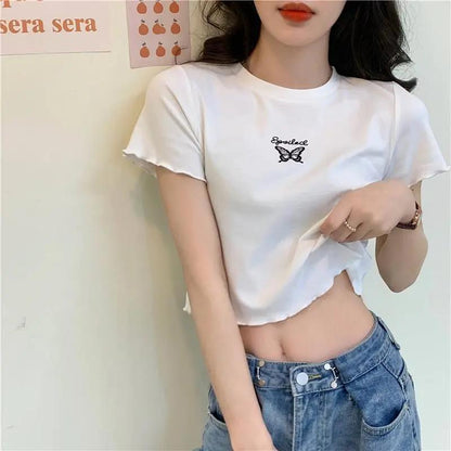 Woman wearing Butterfly Embroidered Crop Top in a sunny park