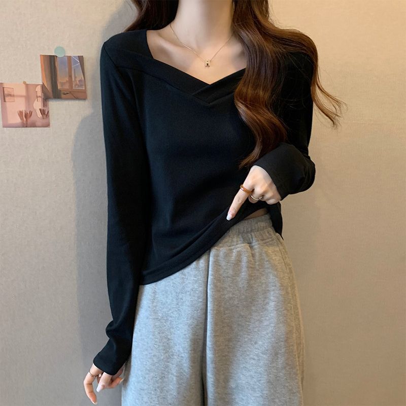 Woman wearing V Neck Long Sleeve Fleece Top in a casual setting