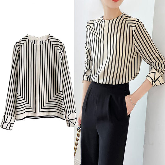 Woman wearing Elegant Striped O Neck Long Sleeve Blouse in a casual setting