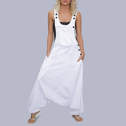 Woman wearing Wide Leg Harem Jumpsuit with Pockets in a sunny outdoor setting