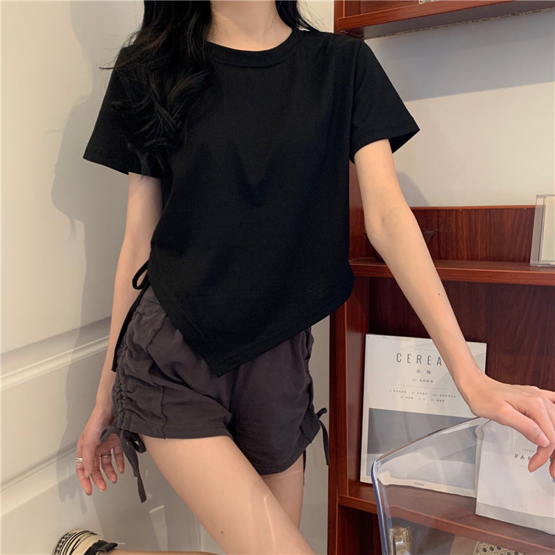 Woman wearing Irregular Drawstring Cropped T-Shirt in a city setting
