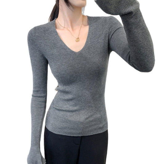 Woman wearing V-Neck Flared Cuff Long Sleeve Knit Top in a casual setting