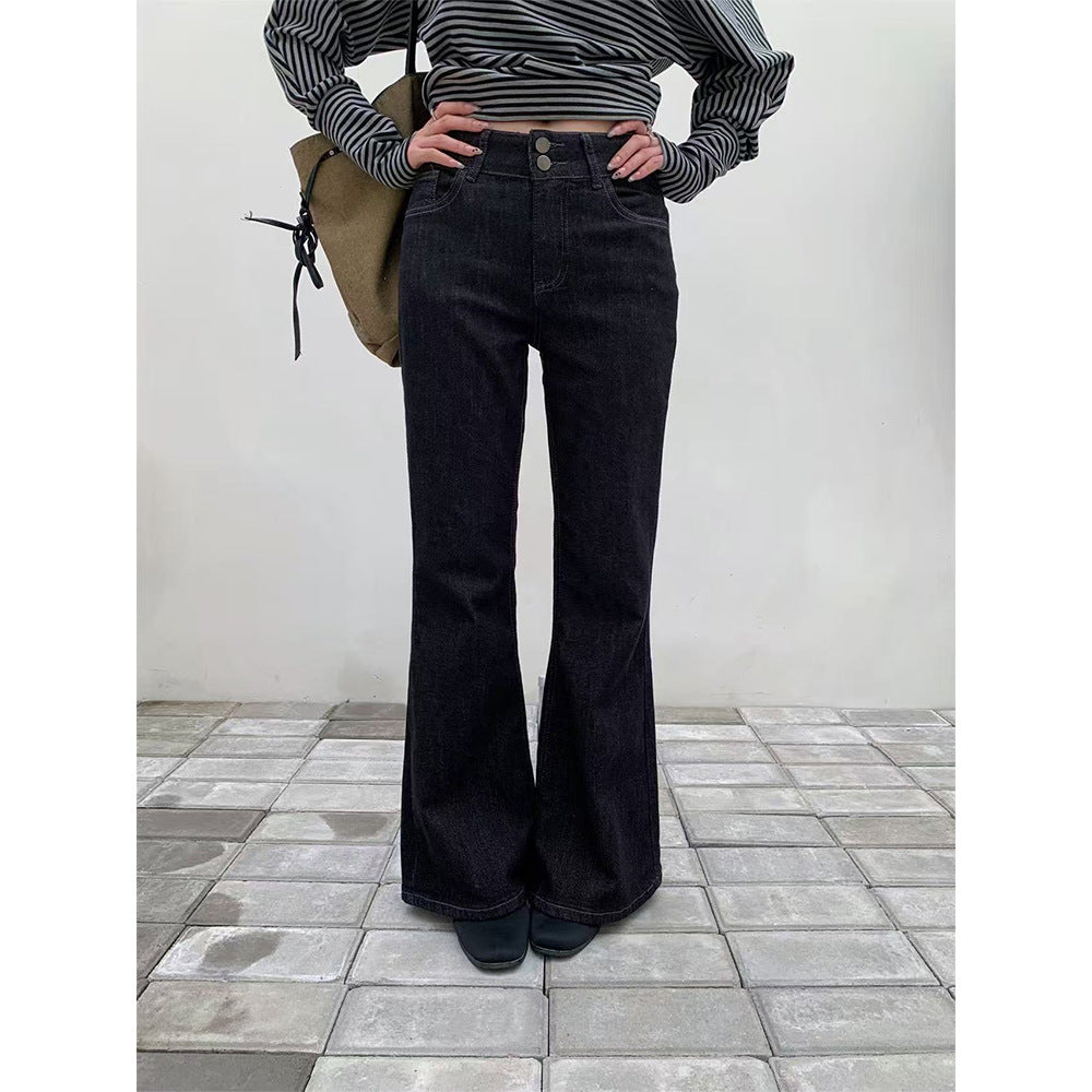 Woman wearing Retro Double Buckle Flared Jeans in a urban street setting