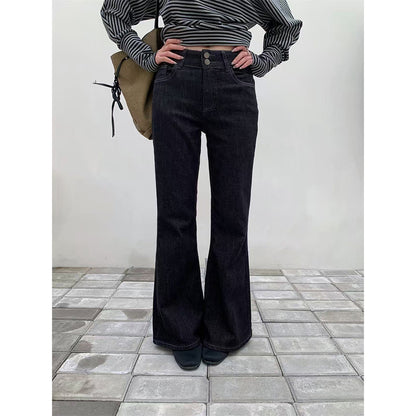 Woman wearing Retro Double Buckle Flared Jeans in a urban street setting