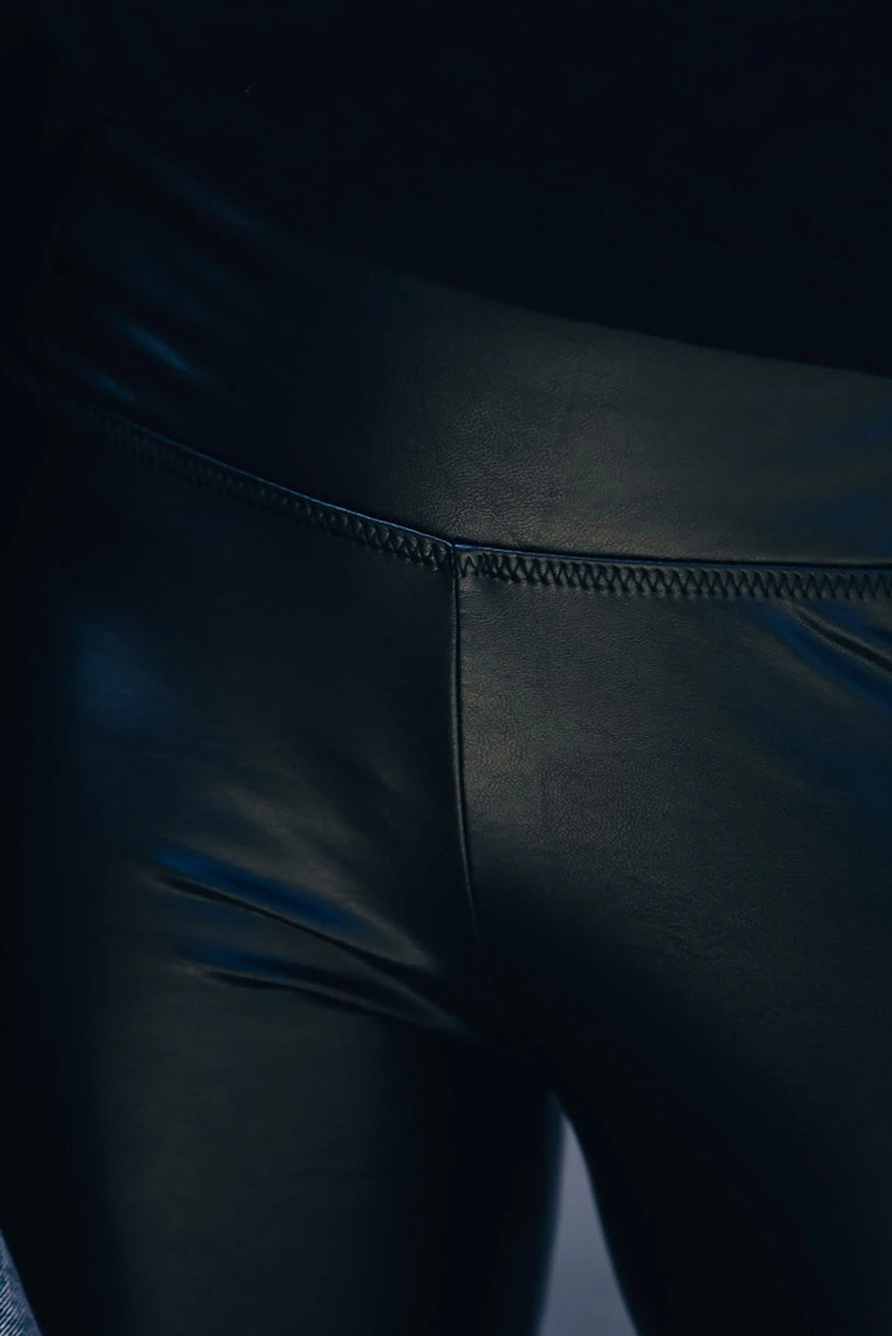 Woman wearing Black Faux Leather High Waist Leggings in a trendy urban setting