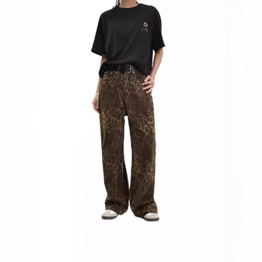 Woman wearing leopard print jeans in a stylish urban setting