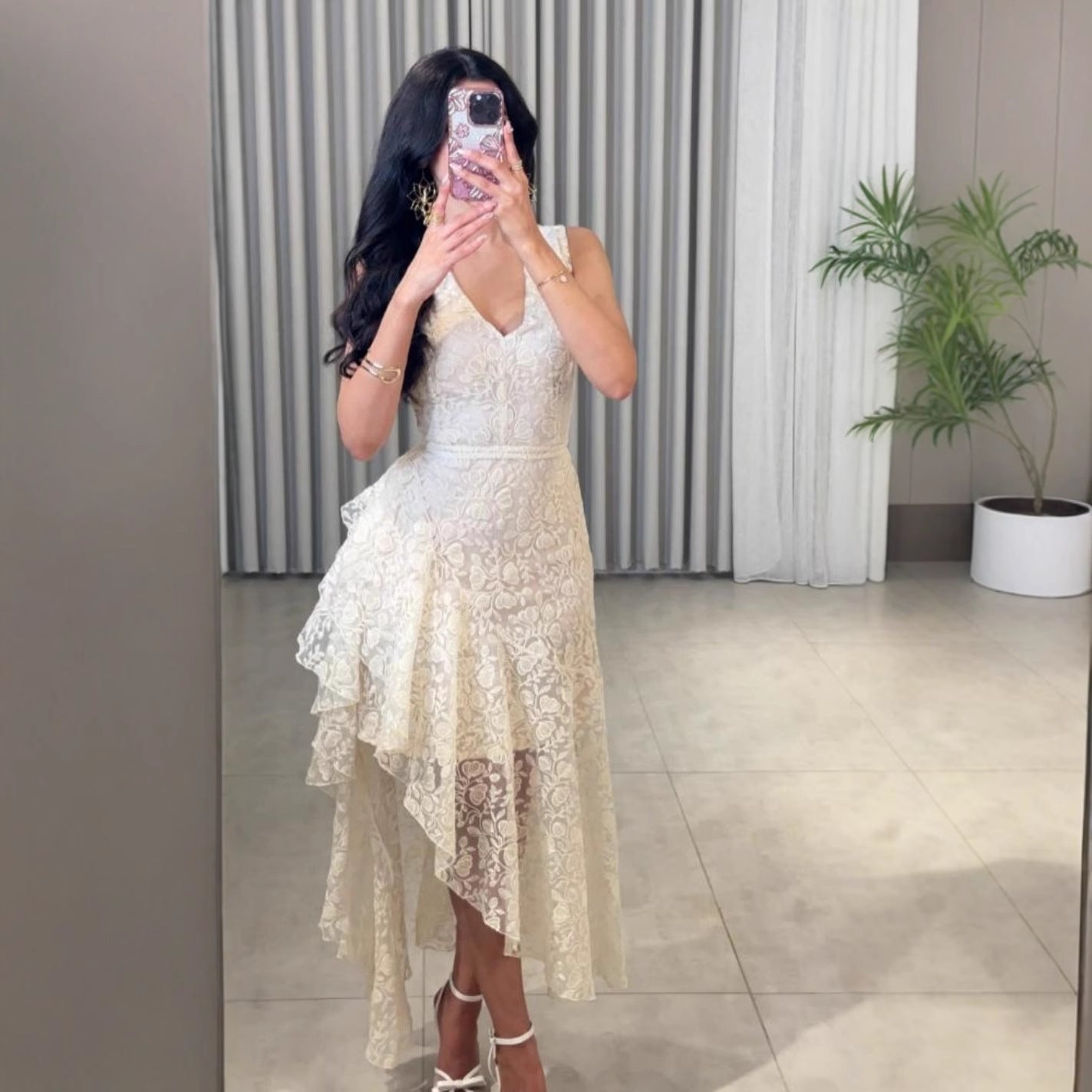 Woman wearing Asymmetric Jacquard Dress in an elegant setting