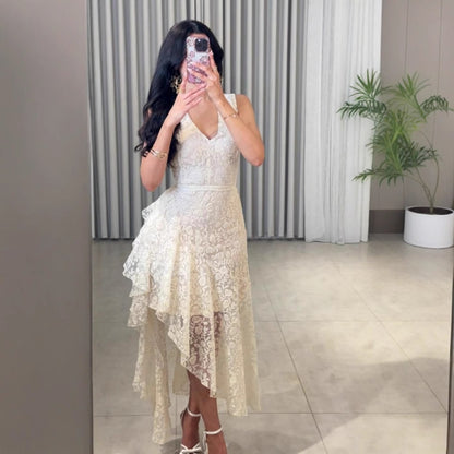 Woman wearing Asymmetric Jacquard Dress in an elegant setting