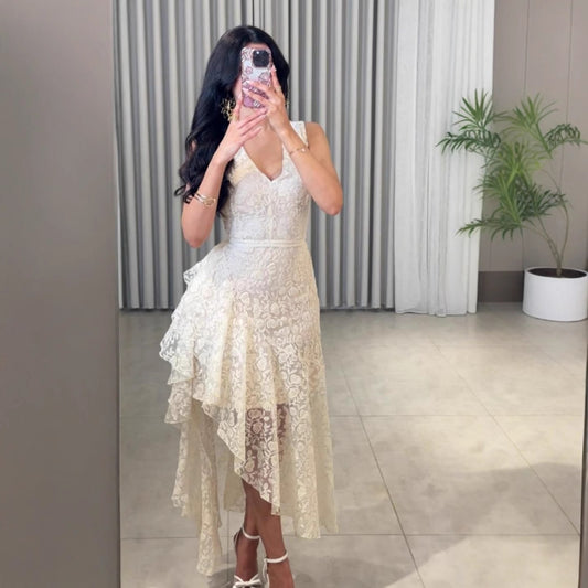 Woman wearing Asymmetric Jacquard Dress in an elegant setting