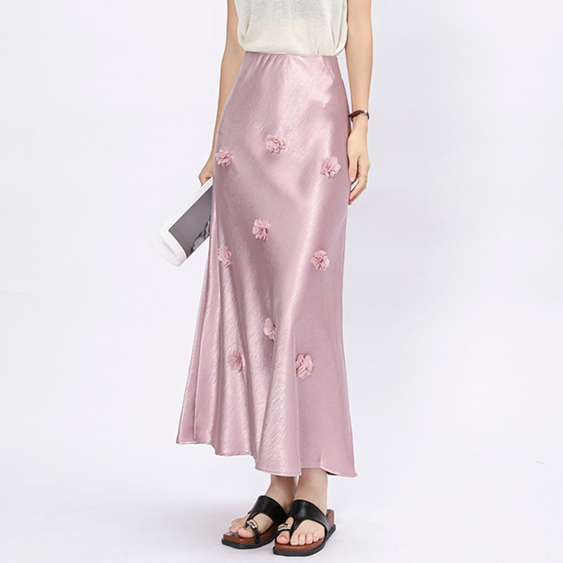Woman wearing 3D floral skirt in a garden setting