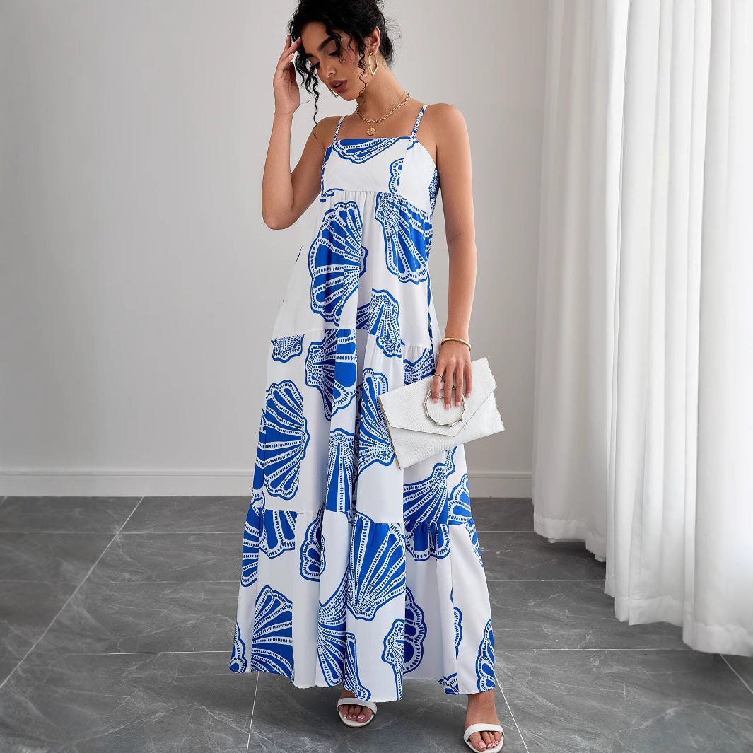 Woman wearing Printed Sleeveless Layered Maxi Dress in a sunny beach setting