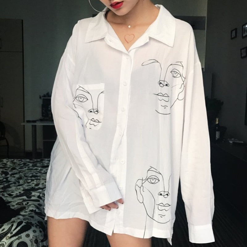 Woman wearing Cotton Face Print Blouse in a summer setting