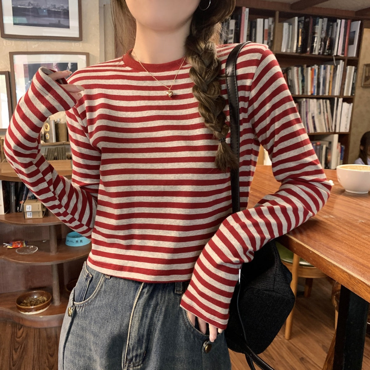 Woman wearing Stripe Long Sleeve Crop Top in a casual setting