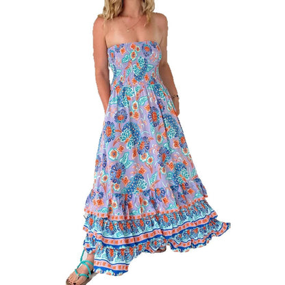 Woman wearing One-Shoulder Floral Ruffle Maxi Dress in a garden