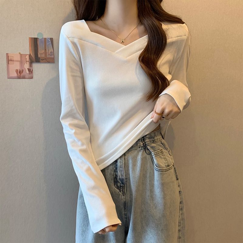 Woman wearing V Neck Long Sleeve Fleece Top in a casual setting