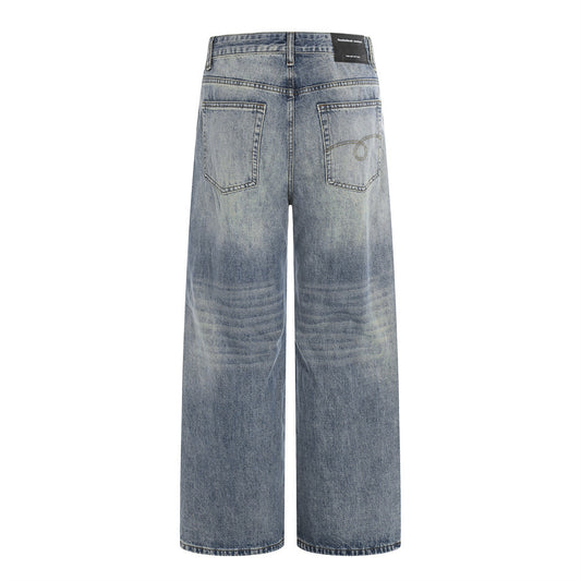 Woman wearing Washed Blue Denim Wide Leg Pants in an urban setting